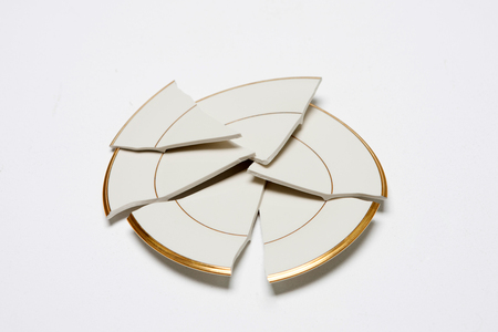 Damaged/Smashed/Broken plate in white backgroundの写真素材