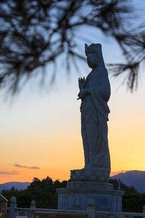 Naksan Temple - Full shot of the statue of the Goddess of Mercy at sunsetのeditorial素材
