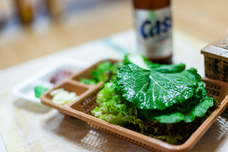 Koeran style cooked seafood - side dish of green vegetable with beerのeditorial素材