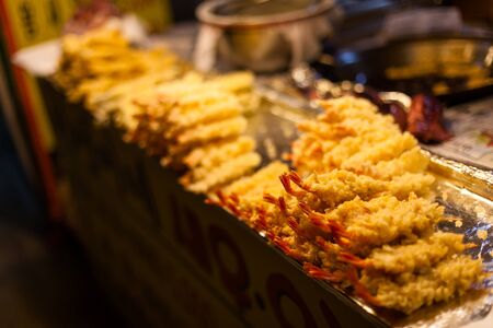 Koeran style cooked seafood - fried shrimps stacked on the stallsの写真素材