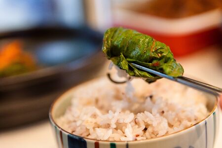 Korean dishes - rice wrapped in a seasoned sesame leafの写真素材