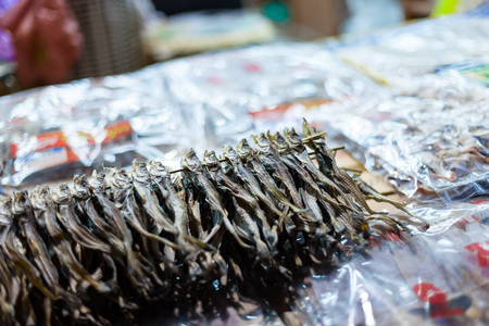 Koeran style cooked seafood - dried anchovies on skewersの写真素材