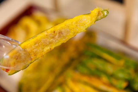 Korean side dishes - pan fried green peppers in eggの写真素材