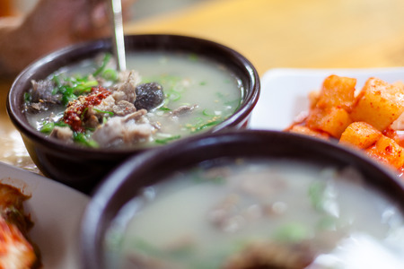 Korean traditional market - pork soup served with kimchIの写真素材