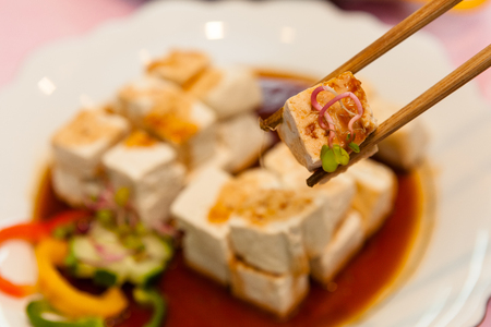 Korean side dishes - diced tofu and soy sauceの写真素材