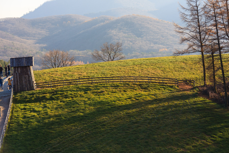 Scenery of fenced ranch with a shed at sunsetのeditorial素材