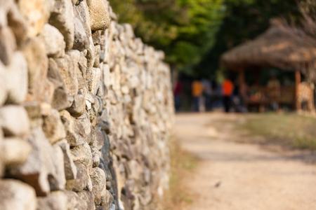 Close up shot of traditionally built stone wall fenceの写真素材