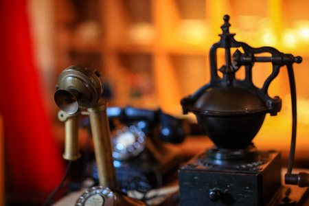 Old classic espresso coffee making tools and old phoneの写真素材