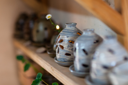 Korean folk village - Pottery kitchen ware props on wooden shelvesのeditorial素材