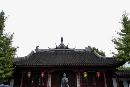 Suzhou, China - Tiled roof and a statue of saintのeditorial素材