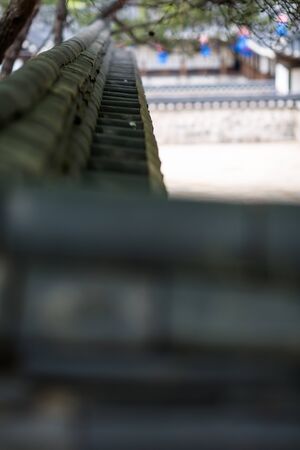 Close up shot of tiled roof brick of stone brick wallの写真素材