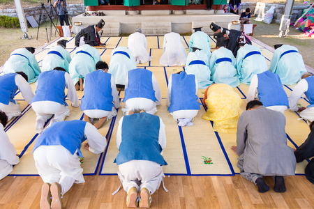 Korea Danoje - Korean men in Hanbok bowing to the altarの写真素材