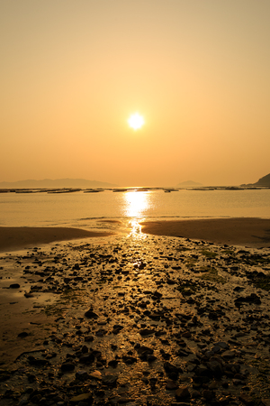 Slow city island-Scenery of sand beach at sunsetの写真素材