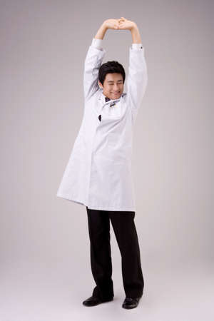 Male Asian doctor posing in a studioの写真素材
