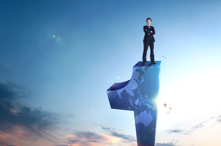 Asain man in business suit with gigantic number 1の写真素材