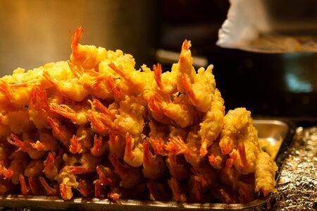 Fried shrimps stacked on the food standの写真素材