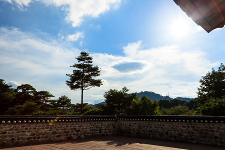 Cornered tiled roof stone wall fenceの写真素材