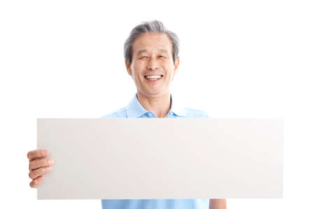 Male Asian elderly posing in a studio with message board