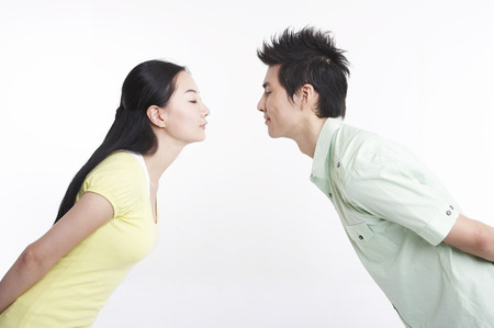 Asian couple posing in clear white studioの写真素材