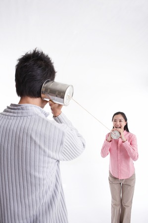 Young Asian couple posing in the studio - isolated on whiteの写真素材