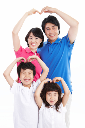 Asian family making heart with their arms - isolated on whiteの写真素材