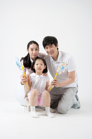 Happy Asian family - isolated on whiteの写真素材