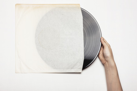 Hands with vinyl disc - isolated on whiteの写真素材