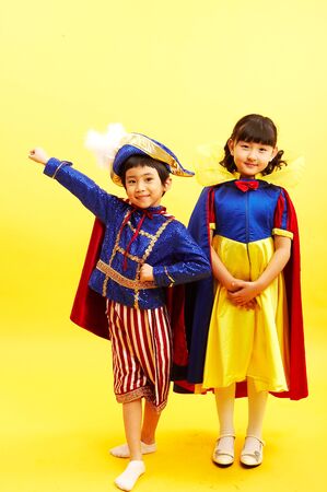 Asian boy in sailor's uniform and girl in the Snow White uniformの写真素材
