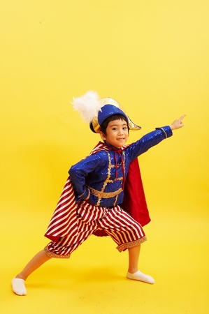 Asian boy in sailor's uniform having funの写真素材