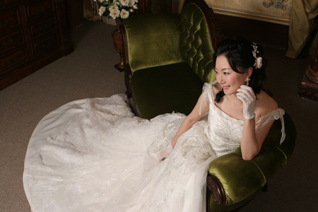 From above Asian lovely bride with wedding dress in antique roomの写真素材