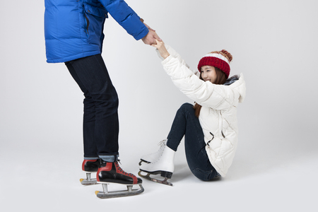 Asian happy couple enjoying winter vacation isolated on whiteの写真素材