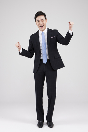Asian young man with joyful isolated on whiteの写真素材
