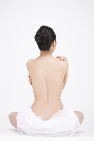 Rear view Asian woman perfect body isolated on whiteの写真素材