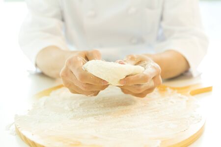 Closeup kneading doughの写真素材