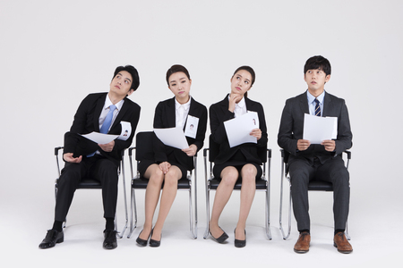 Asian people waiting for job interview isolated on whiteの写真素材