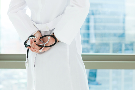 Rear view Asian doctor with stethoscopeの写真素材