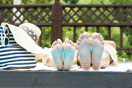 Asian happy couple in swim wear enjoying summer vacation day at poolの写真素材