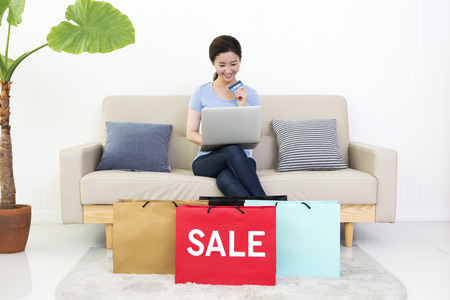 Asian beautiful woman with shopping bagsの写真素材