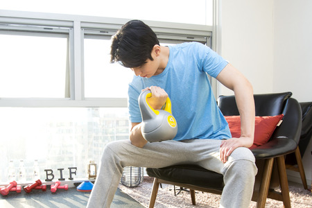 Asian fitness man doing exercise at gym