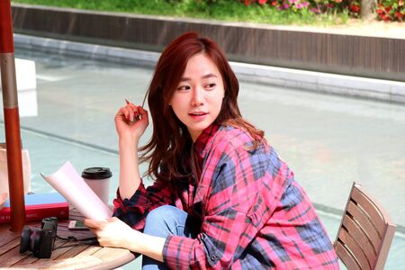 Asian beautiful woman taking a rest at coffee shop