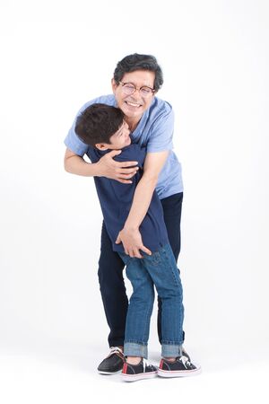 Asian grandfather and grandson looking happy isolated on whiteの写真素材