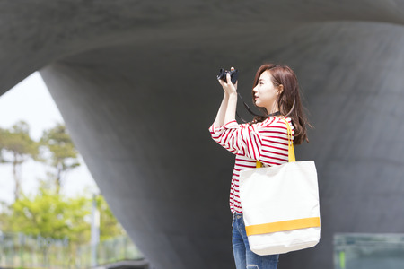Asian woman tourist taking photo