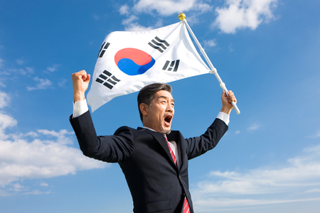 Asian man with Korea flagの写真素材