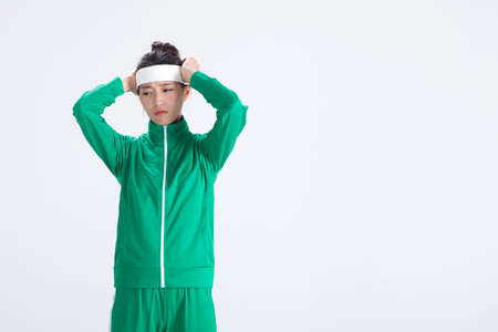Asian woman having headache isolated on white