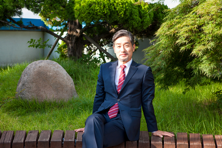 Asian man in suit with smileの写真素材