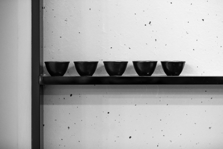 Wooden shelf above the tea cupsの写真素材