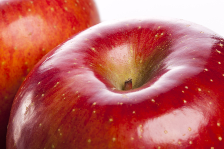 Two red ripe apples isolated on white backgroundの写真素材
