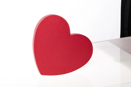 A red heart shaped box isolated on white backgroundの写真素材