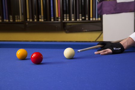 Play billiards on the pool table. 020