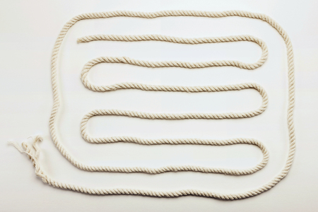 A curved rope on white backgroundの写真素材